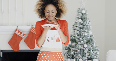 Image showing Young cook with a freshly baked Xmas cake