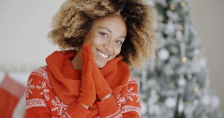 Image showing Smiling happy young woman in a Christmas outfit