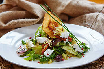 Image showing Fresh spring salad with feta cheese, red onion in white bowl. 