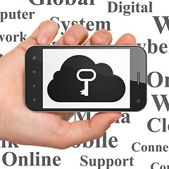 Image showing Cloud networking concept: Hand Holding Smartphone with Cloud With Key on display