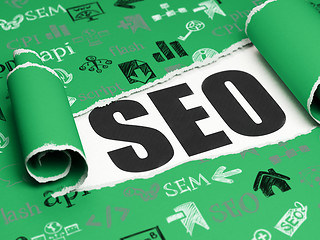 Image showing Web design concept: black text SEO under the piece of  torn paper