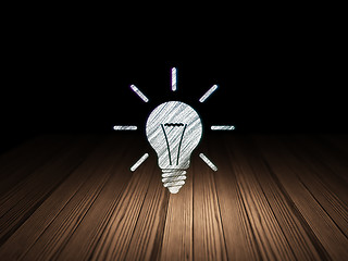 Image showing Finance concept: Light Bulb in grunge dark room