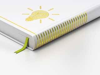 Image showing Finance concept: closed book, Light Bulb on white background