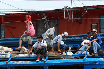 Image showing Passengers on top of Philippine Jeepney.