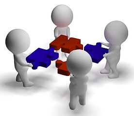 Image showing Jigsaw Pieces Being Joined Showing Teamwork And Assembling