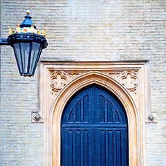 Image showing brown wooden parliament in london old  door and marble antique  