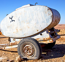 Image showing water tank in morocco africa land gray  metal weel and arid