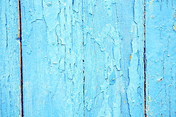 Image showing dirty stripped paint in the blue wood door and  