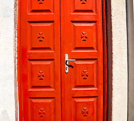 Image showing white  red brown  door in antique village santorini greece europ