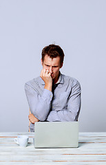 Image showing The man working on laptop in the office