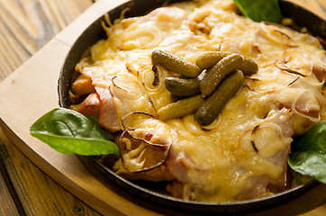 Image showing home made casserole on the wooden table