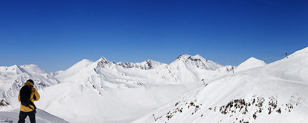 Image showing Snowboarder and panoramic view on ski resort