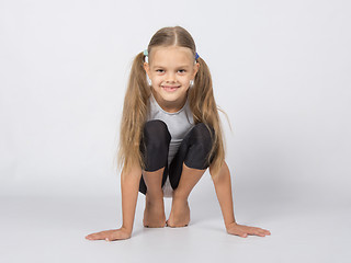 Image showing An aspiring gymnast performs a warm toes