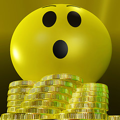 Image showing Surprised Smiley With Coins Showing Sudden Success