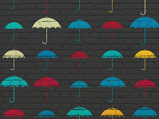 Image showing Privacy concept: Umbrella icons on wall background