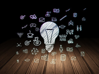 Image showing Business concept: Light Bulb in grunge dark room