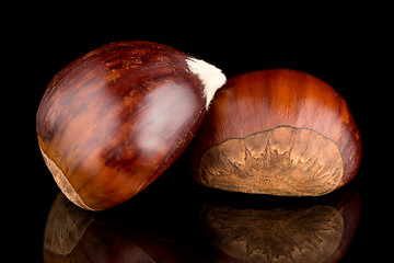 Image showing Chestnuts on a black reflective background