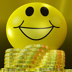 Image showing Smiley Face With Coins Showing Monetary Happiness