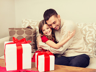 Image showing smiling father and daughter hugging