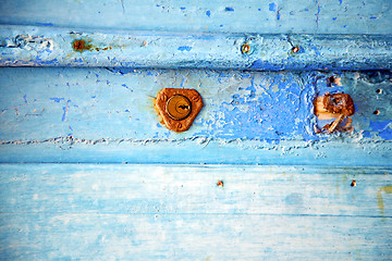 Image showing rusty metal       stripped paint in the blue   knocker