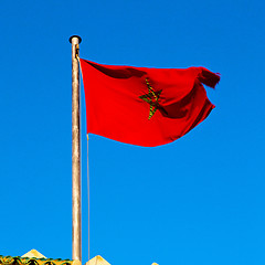 Image showing tunisia  waving flag in the blue sky  colour and battlements  wa