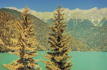 Image showing A picturesque lake surrounded by high mountains.