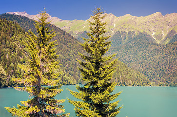 Image showing A picturesque lake surrounded by high mountains.