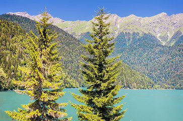 Image showing A picturesque lake surrounded by high mountains.