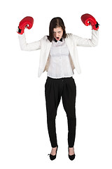 Image showing Angry businesswoman shouts in boxing gloves