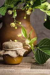 Image showing Jar with lime honey on a table, Close up