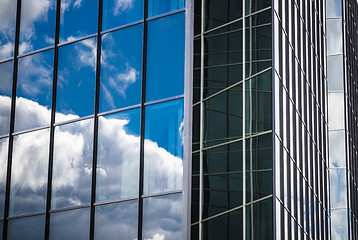 Image showing Glass facade of an office building with reflection of the sky, c