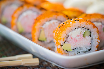 Image showing California maki sushi with orange masago