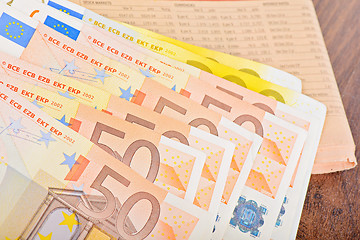 Image showing Close-up of Euro banknotes with newspaper