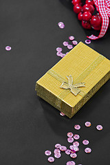Image showing Christmas gift box, pink sequins and decoration