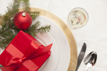 Image showing Christmas Gift with Place Setting at Table