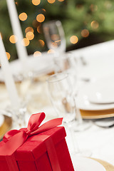 Image showing Christmas Gift with Place Setting at Table