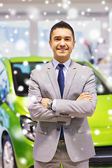 Image showing happy man at auto show or car salon