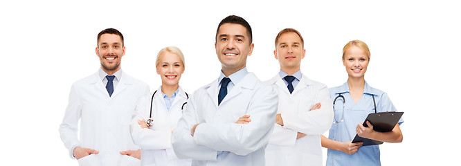 Image showing group of smiling doctors with clipboard