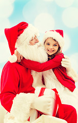 Image showing smiling little girl with santa claus