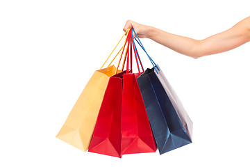 Image showing close up of female hand holding shopping bags