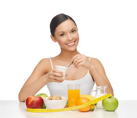 Image showing woman with healthy breakfast and measuring tape