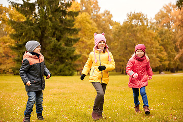 Image showing group of happy little kids running outdoors