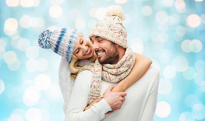 Image showing smiling couple in winter clothes hugging