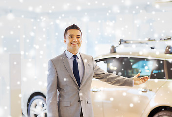 Image showing happy man at auto show or car salon