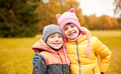 Image showing happy little girl and boy in autumn park