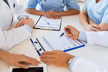 Image showing close up of doctors with clipboards at hospital