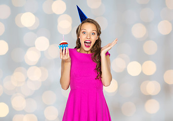 Image showing happy woman or teen girl with birthday cupcake