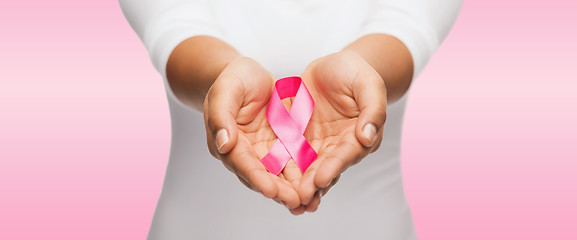 Image showing hands holding pink breast cancer awareness ribbon