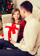 Image showing smiling father and daughter looking at each other