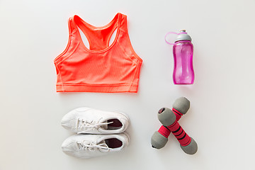 Image showing close up of sportswear, dumbbells and bottle